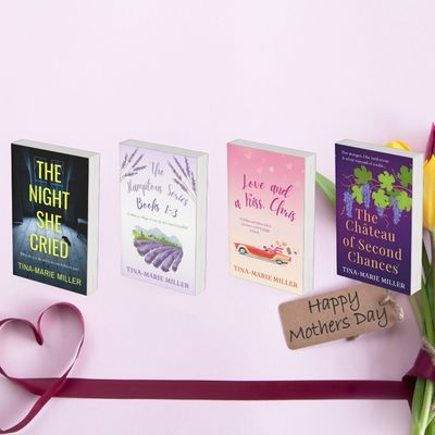 Four book covers next to a bouquet of tulips